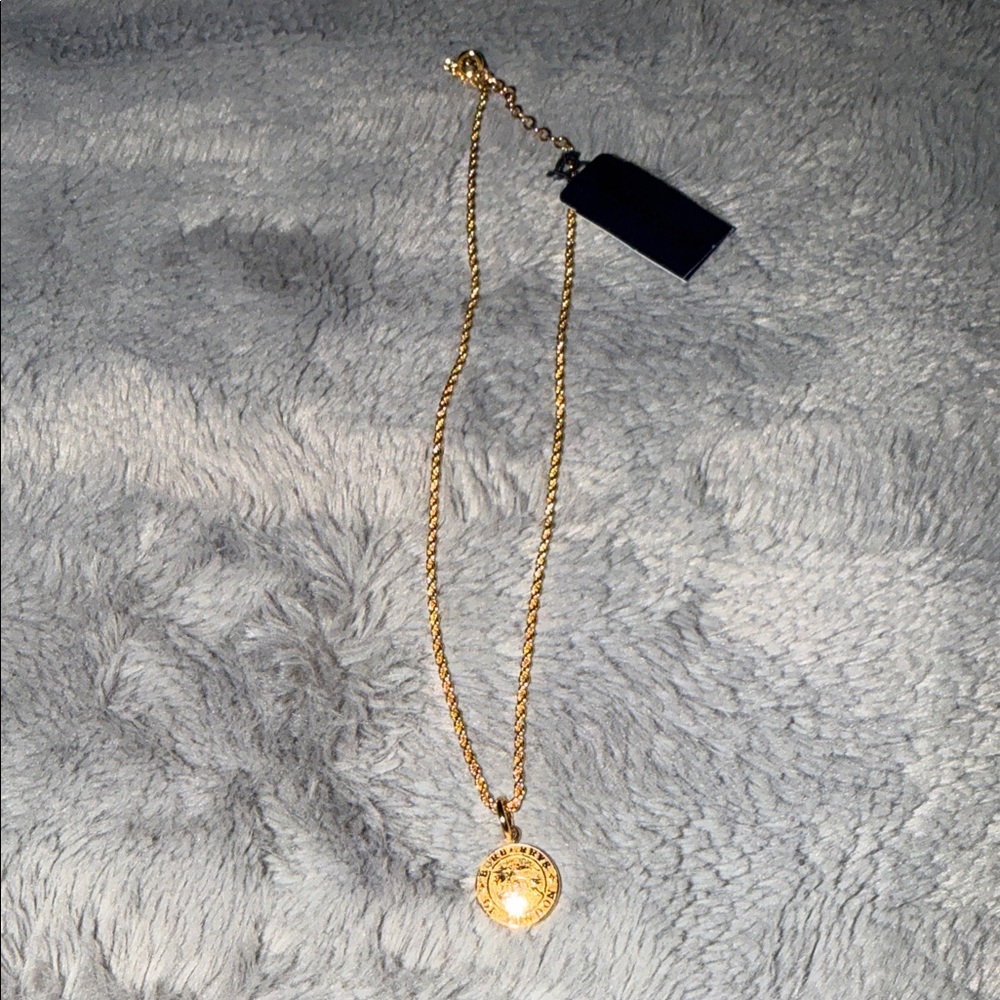 Brand New Burberry Gold Pendant Necklace pristine condition.